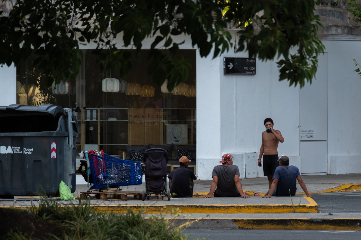 Female cooperative worker in green uniform looking out over the sorting facility, Buenos Aires