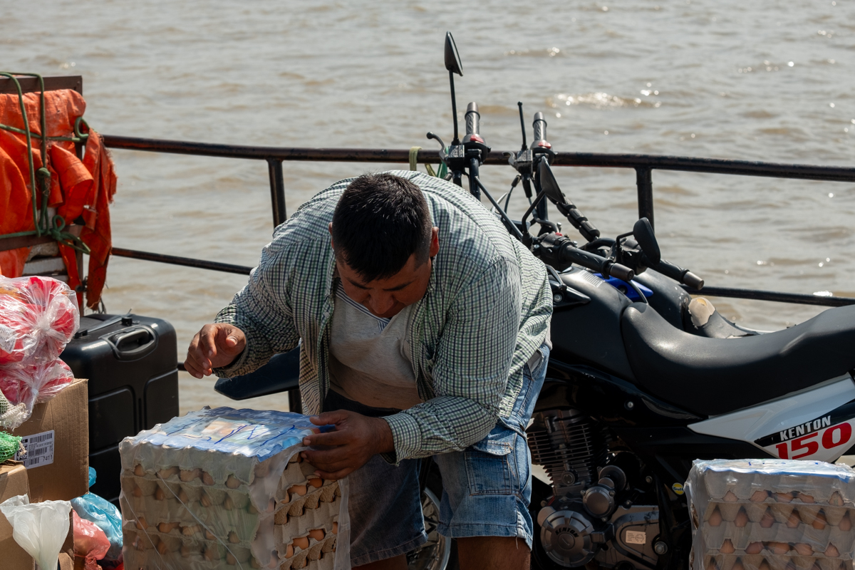 Captain of the Aquidaban drinking mate in the wheelhouse of the ageing river boat, Río Paraguay