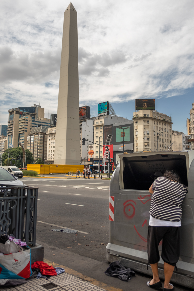 Cartonero cooperative worker standing in a large industrial recycling facility, Buenos Aires